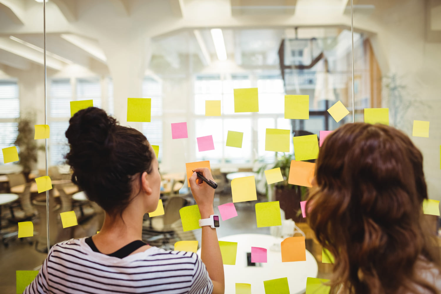business-executives-writing-sticky-notes